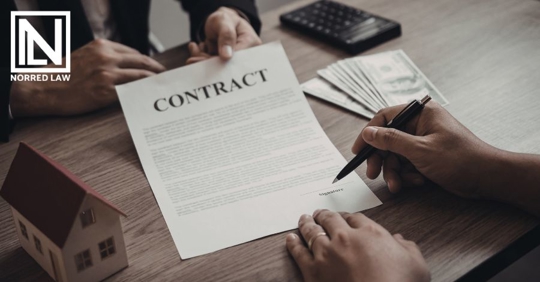 person signing business contract