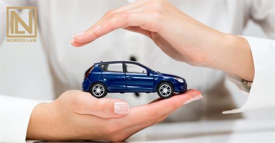 hands protecting a small car